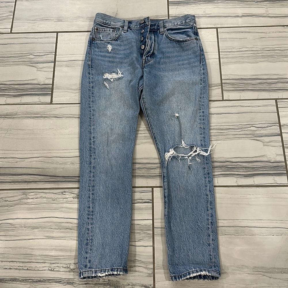 Vintage Levi jeans, with distressing. Size 28.